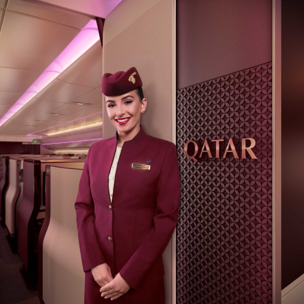 Qatar-Airways-Qsuite-business-class - Lady-welcoming-in-Business-Class.jpeg